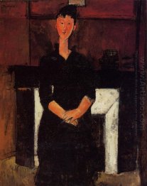 woman seated by a fireplace 1915