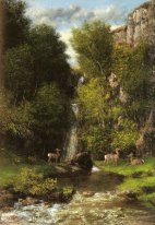 A Family Of Deer In A Landscape With A Waterfall