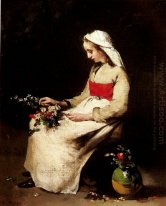 En flicka Arrange en vas med blommor