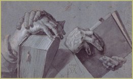 two hands holding a pair of books