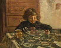 Un enfant assis à table