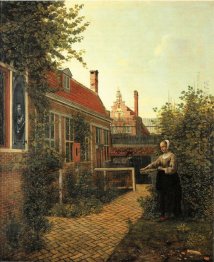 Woman with basket of beans in the kitchen garden