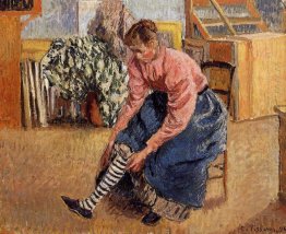 woman putting on her stockings 1895