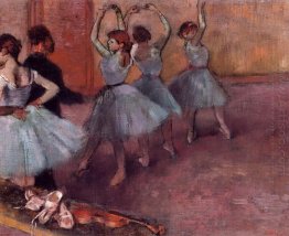 dancers in light blue rehearsing in the dance studio