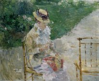 Young Woman Sewing In The Garden