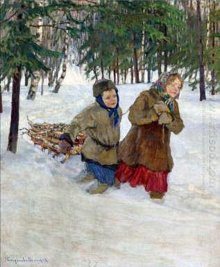 Enfants transportant le bois dans la neige de l\'hiver