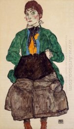 woman in a green blouse and muff 1915