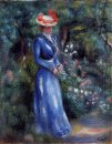 Frau in einem blauen Kleid steht im Garten von Saint Cloud 1899