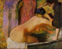 Femme à sa salle de bain