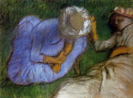 young women resting in a field