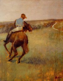 jockey in blue on a chestnut horse