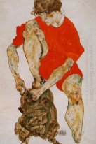 женская модель в ярко-красный пиджак и брюки 1914