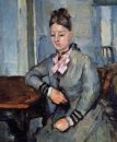 Madame Cezanne leunend op Een Tafel